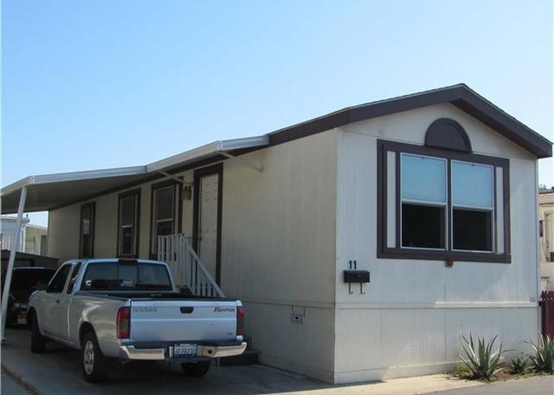 Green Crest Mobile Home Park in Escondido, CA - a well-maintained mobile home community with mature trees and clean streets